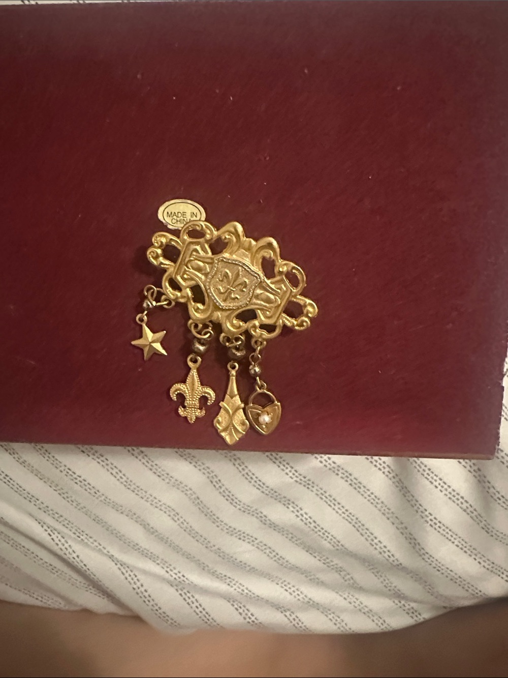 Avon Gold-Tone Dangling Charm Brooch with Fleur-de-Lis and Heart